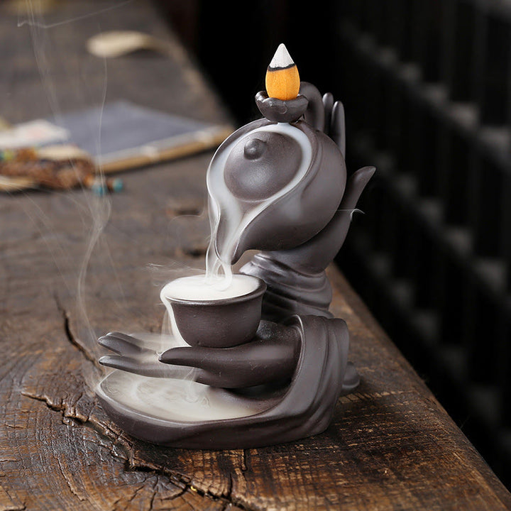 Buddha Stones Buddha Hand Holding Teapot Cup Ceramic Backflow Smoke Fountain Healing Incense Burner Decoration - Brown Black 13.7*9*13.9cm - image 1