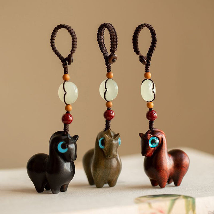 Buddha Stones Year of the Horse Small Leaf Red Sandalwood Green Sandalwood Ebony Wood Calm Key Chain - image 1