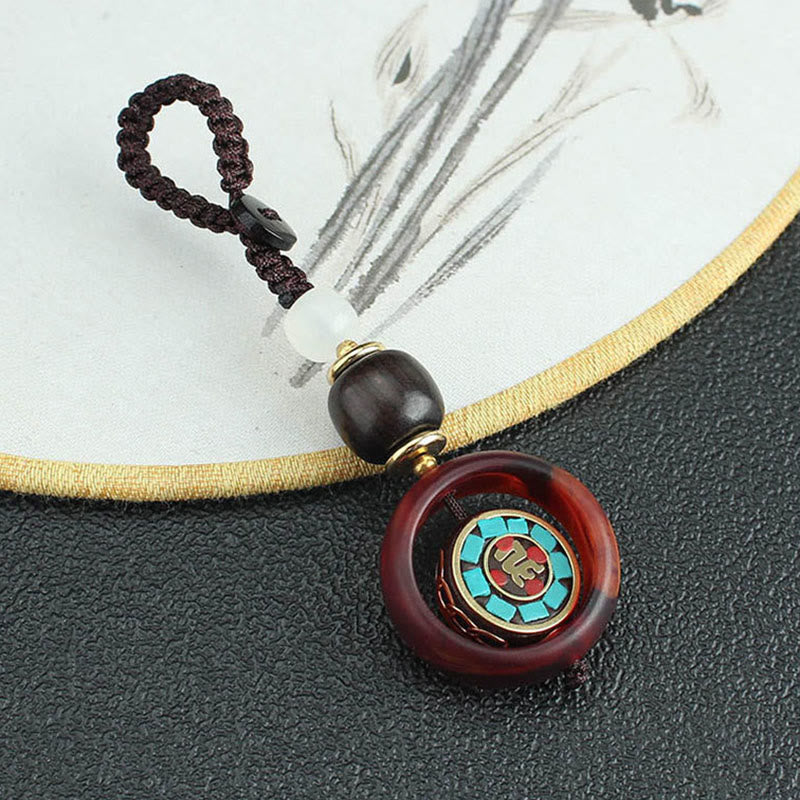 Buddha Stones Ebony Wood Sanskrit Four-leaf Clover Buddha's Eye Peace Rotatable Key Chain - image 1