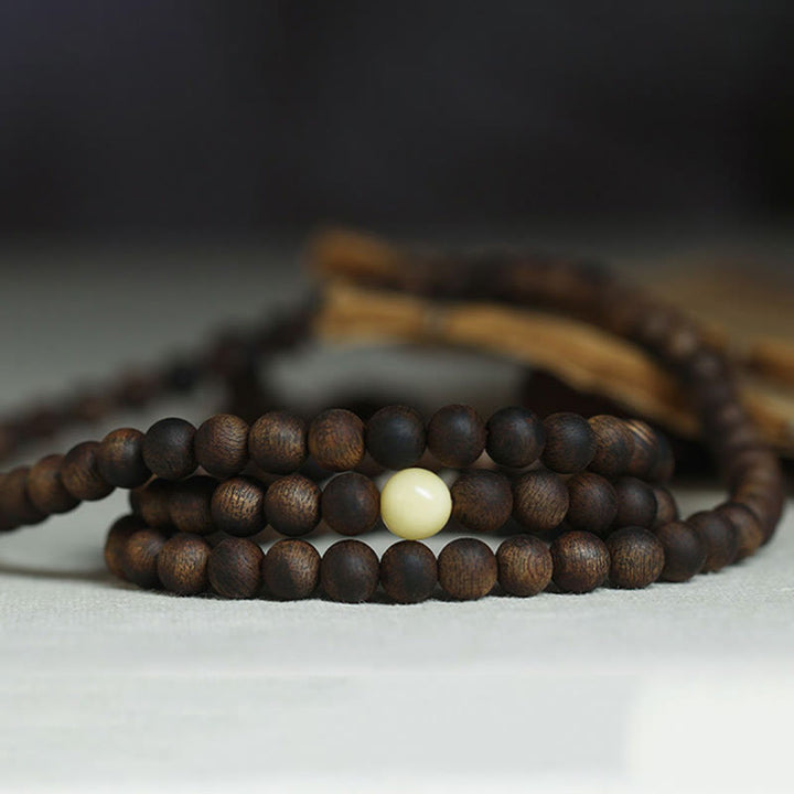 Buddha Stones 999 Gold Tarakan 108 Mala Beads Agarwood Amber Ward Off Evil Spirits Bracelet