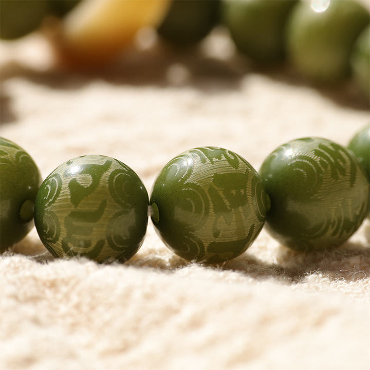 Buddha Stones Green Bodhi Seed Ivory Fruit Dancing Lion Om Mani Padme Hum Engraved Peace Bracelet